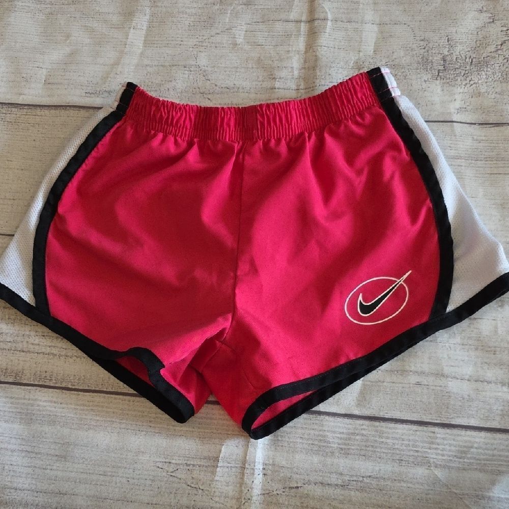 Red Athletic Shorts with Swoosh Logo